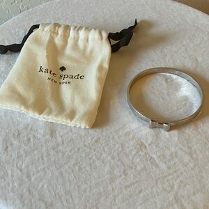 Kate Spade: Silver Tone Bow Bracelet- Marks